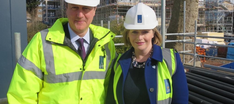 Mary with David Cameron at housing development